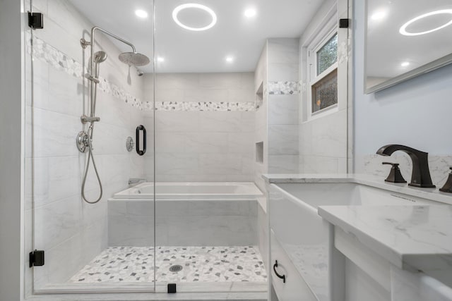 38 Mill St, Dennis Port, MA 02639 - bathroom with recessed lighting, vanity, a tub, and a stall shower