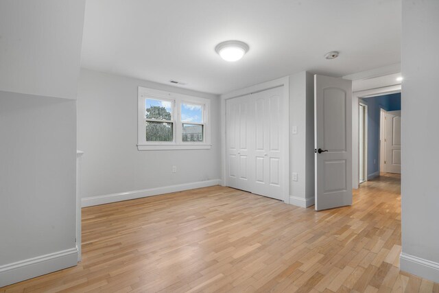 38 Mill St, Dennis Port, MA 02639 - unfurnished bedroom with a closet, light wood-style floors, visible vents, and baseboards