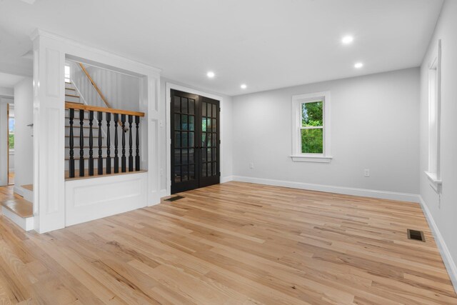 38 Mill St, Dennis Port, MA 02639 - empty room with baseboards, wood finished floors, visible vents, and stairs