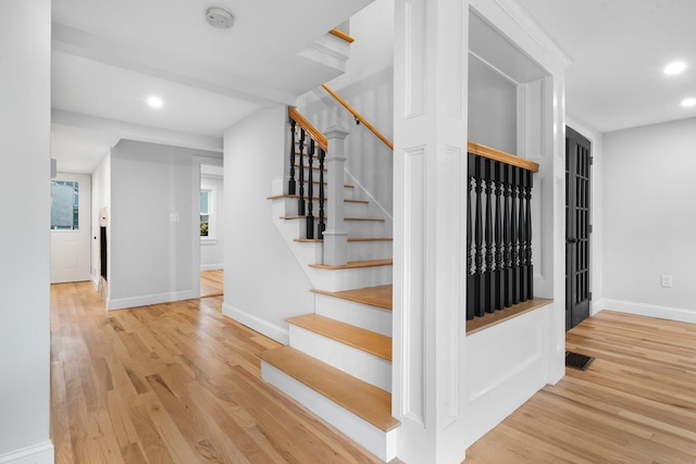 38 Mill St, Dennis Port, MA 02639 - stairway with baseboards, wood finished floors, visible vents, and recessed lighting