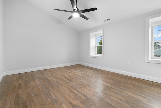 38 Mill St, Dennis Port, MA 02639 - empty room featuring hardwood / wood-style floors, baseboards, vaulted ceiling, and visible vents