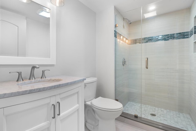 38 Mill St, Dennis Port, MA 02639 - full bath with a shower stall, toilet, and vanity