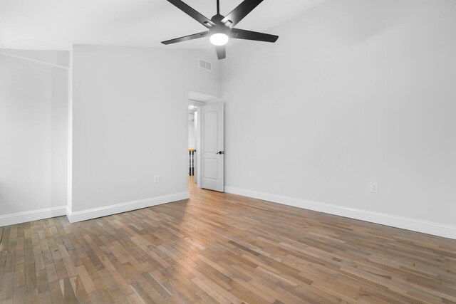 38 Mill St, Dennis Port, MA 02639 - empty room with baseboards, wood finished floors, high vaulted ceiling, and ceiling fan