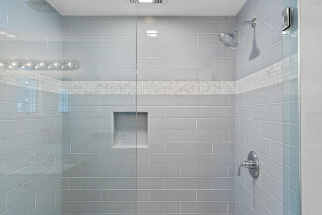 full bath featuring a stall shower and visible vents