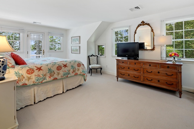 bedroom with light colored carpet