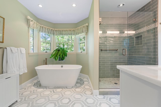 bathroom with plus walk in shower, radiator, vanity, and tile patterned floors