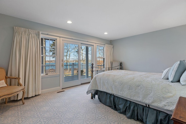 bedroom with access to exterior, baseboards, and recessed lighting