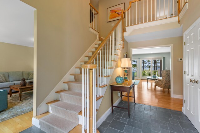 entryway featuring vaulted ceiling