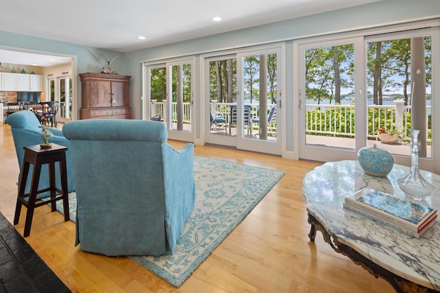 living room featuring light wood finished floors and recessed lighting