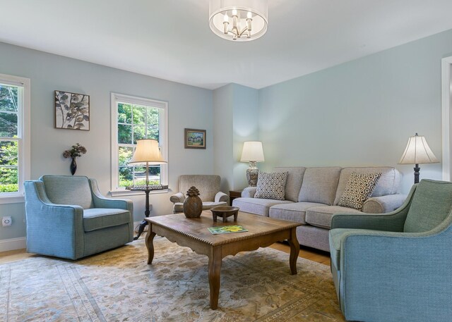 living room featuring a water view and light wood-type flooring