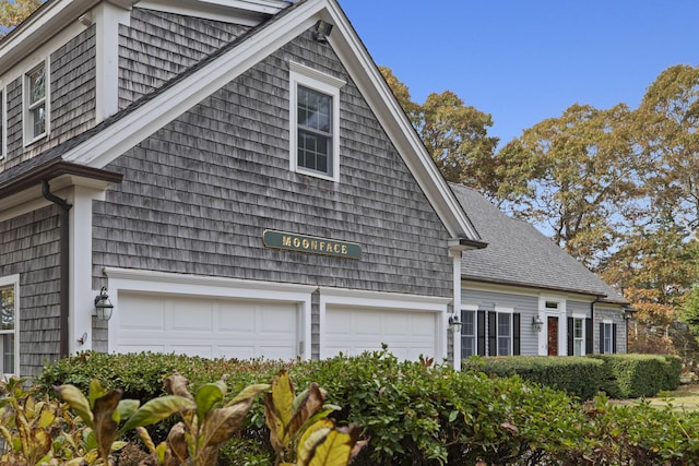 view of side of property with a garage