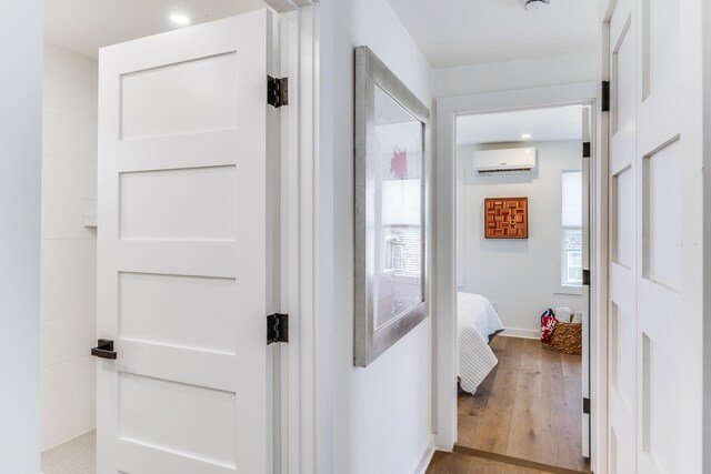 36 Pearl St Unit 2, Provincetown, MA 02657 - corridor with a wall unit AC, wood finished floors, and baseboards