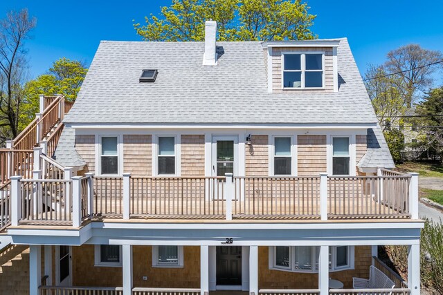 36 Pearl St Unit 2, Provincetown, MA 02657 - back of house with a balcony, a chimney, and roof with shingles