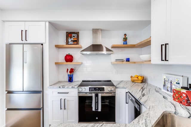 36 Pearl St Unit 2, Provincetown, MA 02657 - kitchen featuring stainless steel appliances, wall chimney range hood, open shelves, white cabinets, and decorative backsplash