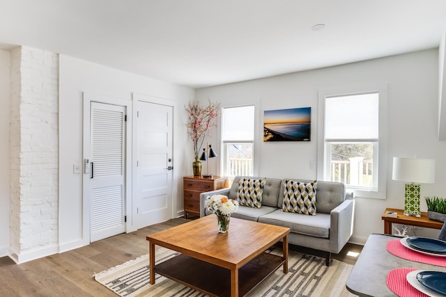 36 Pearl St Unit 2, Provincetown, MA 02657 - living room featuring healthy amount of natural light, light wood-type flooring, and baseboards