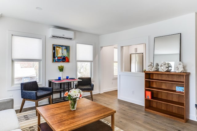 36 Pearl St Unit 2, Provincetown, MA 02657 - living room featuring a wall mounted air conditioner and light wood finished floors