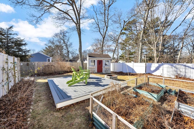 view of yard with a deck and a shed