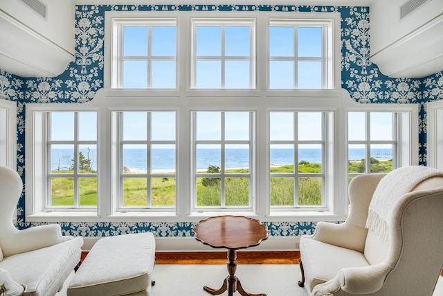 391 Sea View Ave, Osterville, MA 02655 - sitting room featuring wallpapered walls, a water view, and healthy amount of natural light