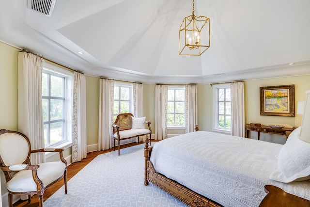 391 Sea View Ave, Osterville, MA 02655 - bedroom with a chandelier, a tray ceiling, wood finished floors, and recessed lighting