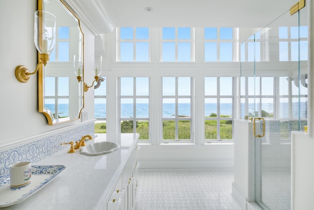 391 Sea View Ave, Osterville, MA 02655 - bathroom with a water view, vanity, and a shower stall