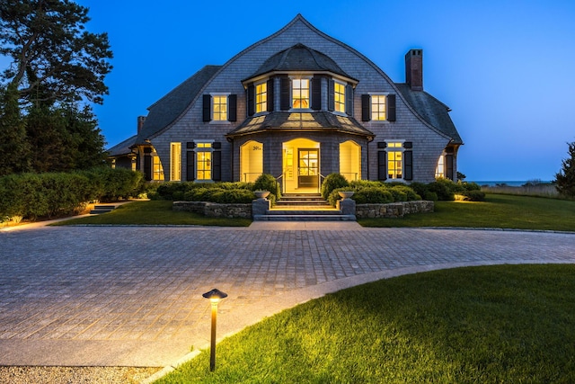 391 Sea View Ave, Osterville, MA 02655 - shingle-style home featuring a chimney, a front lawn, and curved driveway