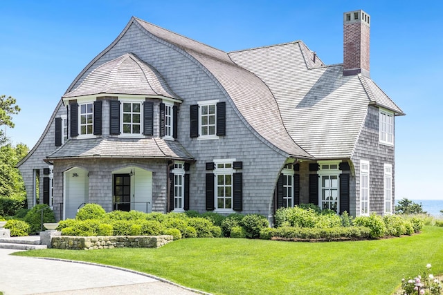 391 Sea View Ave, Osterville, MA 02655 - shingle-style home with a chimney and a front lawn