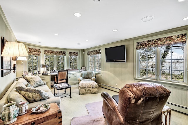 living room featuring crown molding, baseboard heating, recessed lighting, and light wood-type flooring