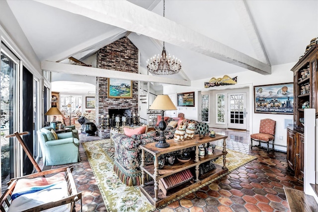 living area with a chandelier, beamed ceiling, plenty of natural light, a fireplace, and high vaulted ceiling