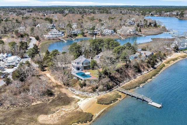 aerial view of property and surrounding area with a large body of water