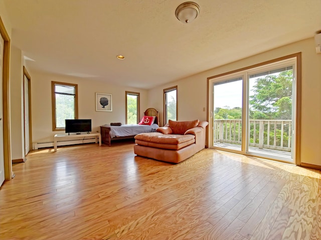 30 Norris Path, Teaticket, MA 02536 - living area featuring a baseboard radiator, light wood finished floors, recessed lighting, and baseboards