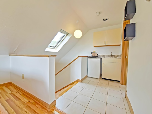 30 Norris Path, Teaticket, MA 02536 - kitchen featuring dishwasher, a skylight, light countertops, vaulted ceiling, and baseboards