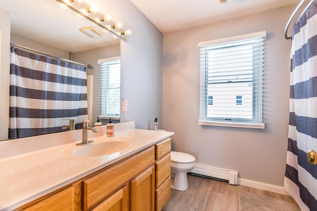 bathroom featuring wood-type flooring, toilet, vanity, and a baseboard heating unit