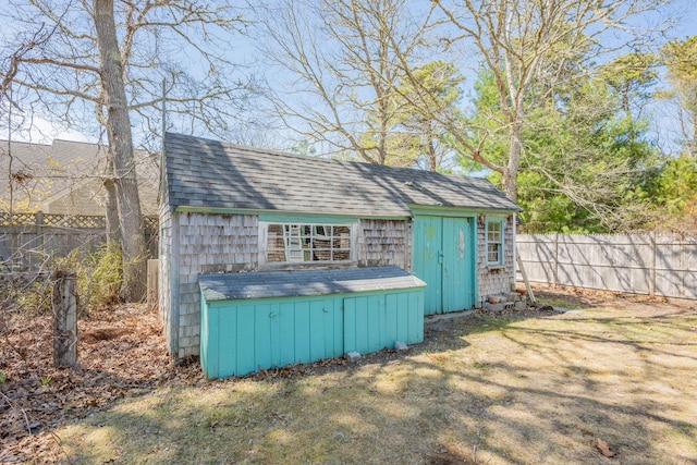 view of shed with fence