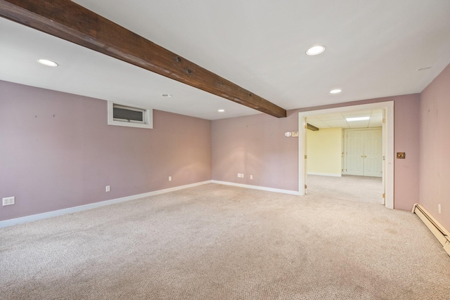 carpeted spare room featuring a baseboard radiator and beam ceiling