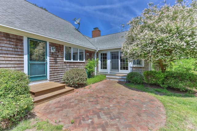 property entrance featuring a patio area