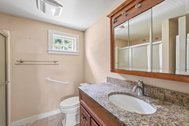 bathroom featuring tile patterned floors, toilet, an enclosed shower, and vanity