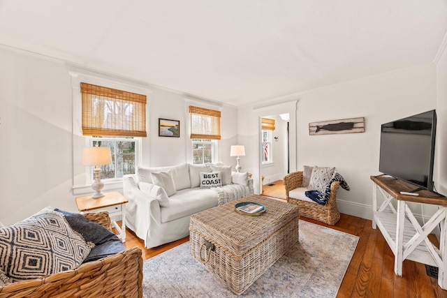 living room featuring crown molding and hardwood / wood-style floors