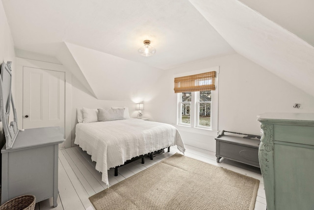 bedroom featuring lofted ceiling