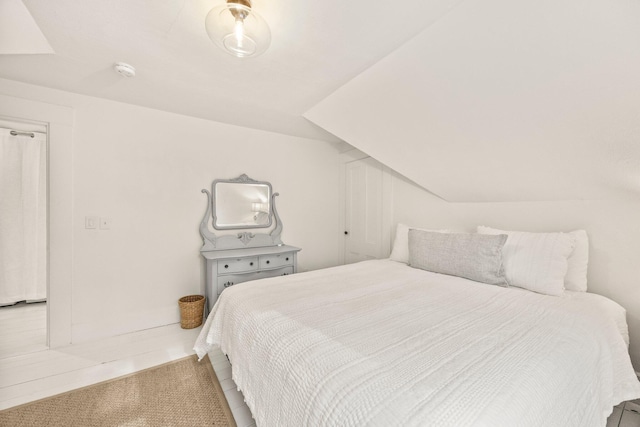 bedroom with lofted ceiling