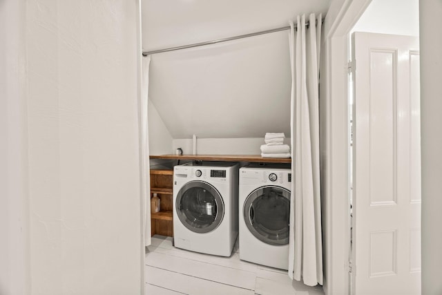 laundry room featuring washing machine and dryer