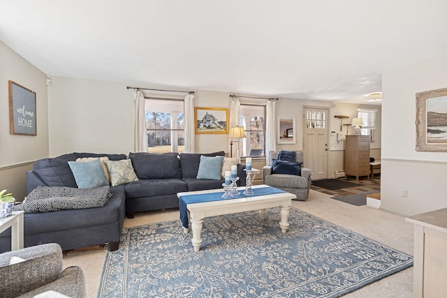 living area with carpet and a baseboard radiator