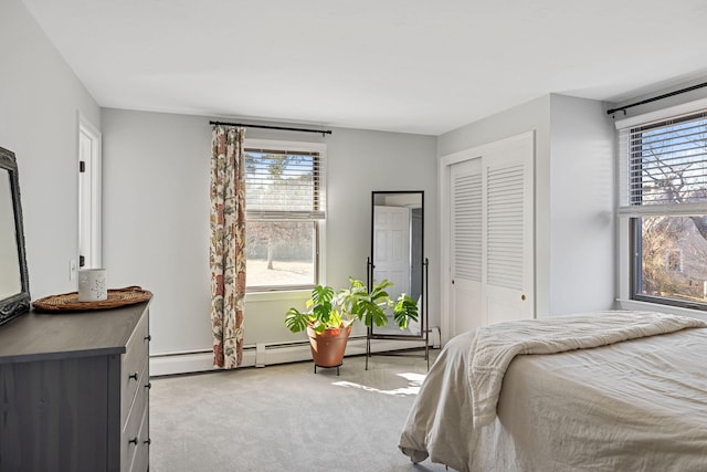 bedroom with a closet and light carpet