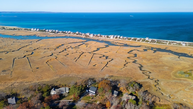 drone / aerial view featuring a water view and a view of the beach