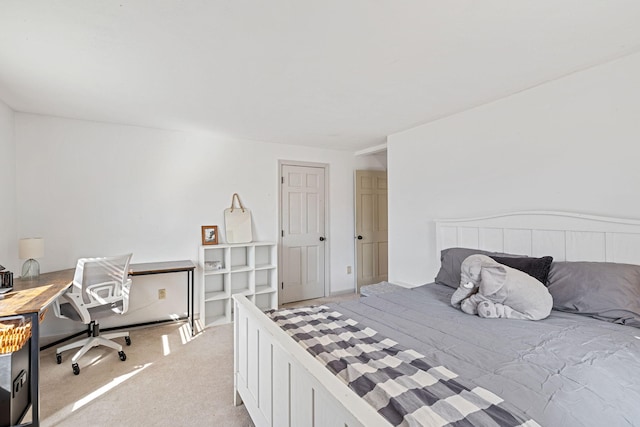 bedroom with light colored carpet