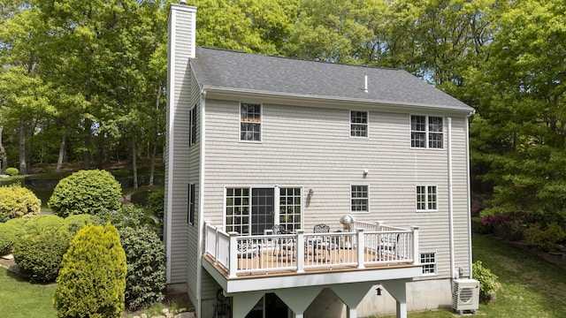 2181 Service Rd, West Barnstable, MA 02668 - rear view of house with a chimney, a wooden deck, a shingled roof, and a yard