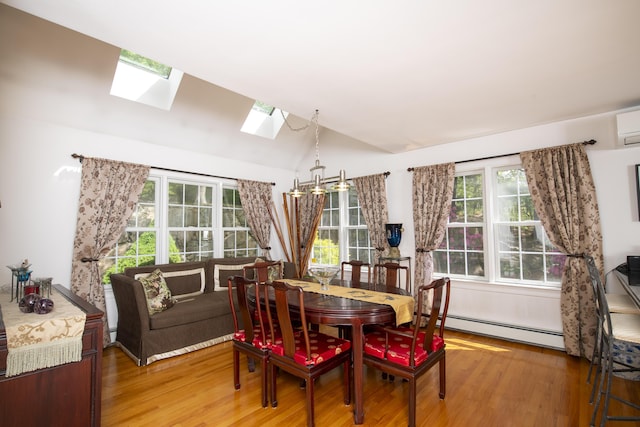 2181 Service Rd, West Barnstable, MA 02668 - dining area with a baseboard radiator, a skylight, light wood-style flooring, healthy amount of natural light, and vaulted ceiling