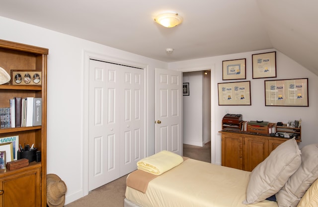 2181 Service Rd, West Barnstable, MA 02668 - carpeted bedroom featuring a closet and vaulted ceiling