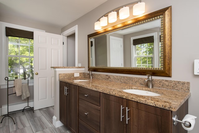 2181 Service Rd, West Barnstable, MA 02668 - bathroom with a baseboard heating unit and double vanity