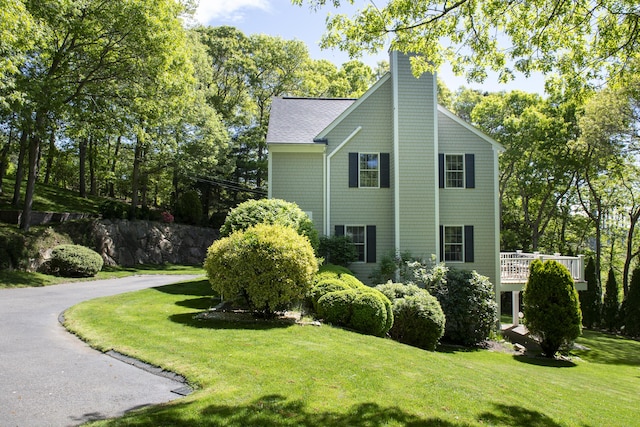 2181 Service Rd, West Barnstable, MA 02668 - view of property exterior with a chimney and a lawn