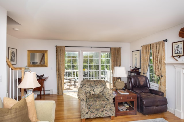 2181 Service Rd, West Barnstable, MA 02668 - living room with wood finished floors and a baseboard radiator